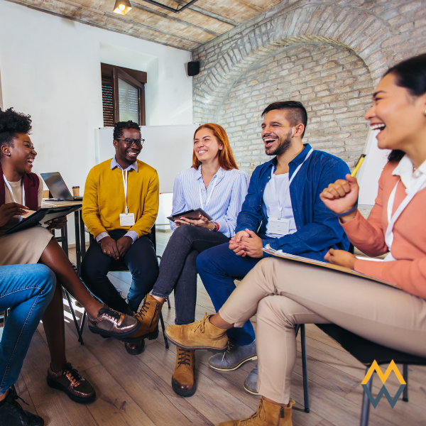 An informal meeting of a group of happy employees.